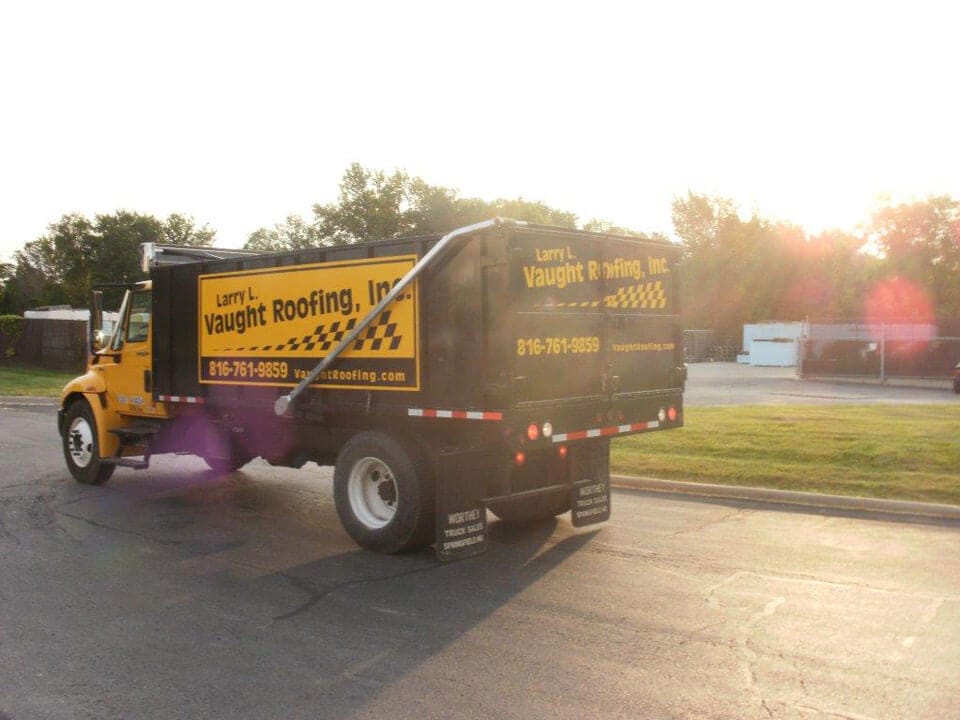 Vaught Roofing Photo Gallery: Yellow dump truck 01